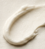 A rounded swatch of skincare cream