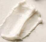 A compact, irregular skincare cream swatch